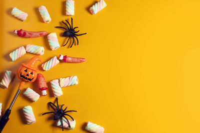 High angle view of stuffed toy against yellow background