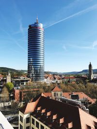 Buildings in city against sky