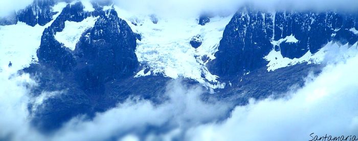 Close-up of snowcapped mountains against sky