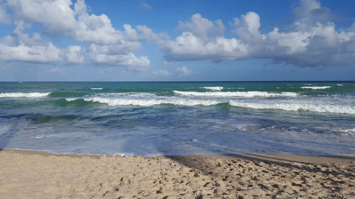 Scenic view of beach against sky