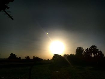 Scenic view of field against sky during sunset