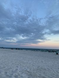 Scenic view of beach against sky during sunset