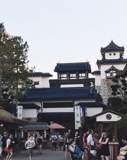 People at town square against clear sky