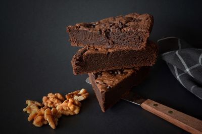 Close-up of chocolate fudge with walnut on table