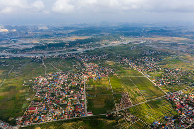 High angle view of city buildings against sky