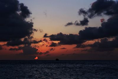 Scenic view of sea against sky at sunset