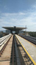 Railroad station platform against sky