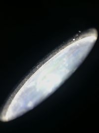 Close-up of airplane against sky at night