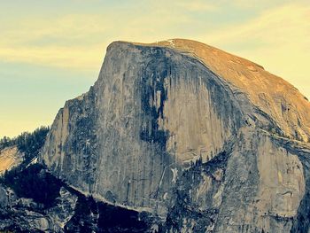 Low angle view of rock formations against sky