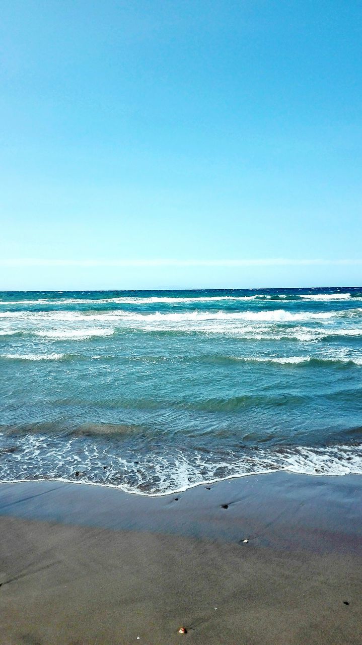 sea, horizon over water, beach, beauty in nature, wave, scenics, nature, clear sky, water, blue, copy space, tranquility, no people, day, tranquil scene, sand, sky, outdoors, sunlight, summer