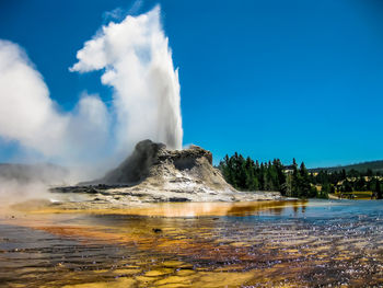 Geyser spraying at yellowstone national park