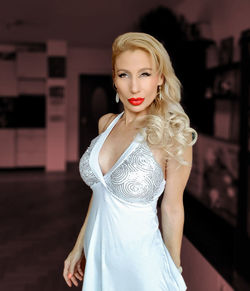 Portrait of woman standing at home