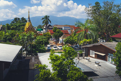 High angle view of trees and buildings against sky