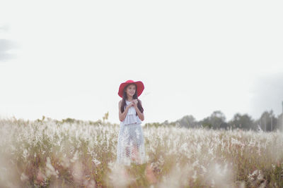 Woman standing on field