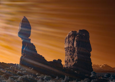 Close-up of rock formation against sky during sunset
