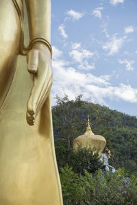 Statue of buddha against sky