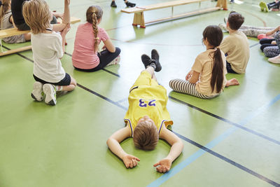 Children having class in school gym