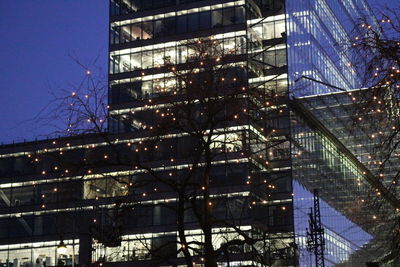 Low angle view of office building against sky