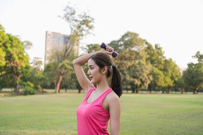 Full length of woman standing on field