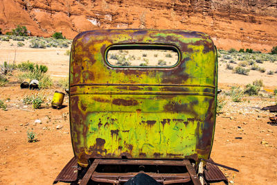 Abandoned car on field