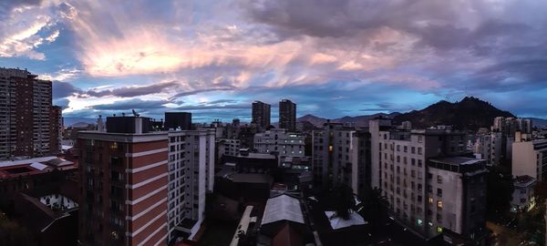 Panoramic view of buildings against sky during sunset