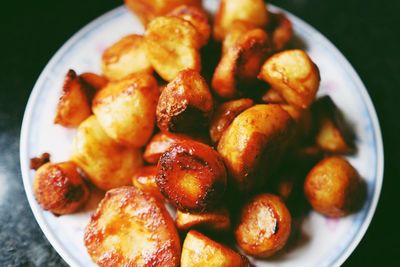Close-up of served fried potatoes in plate