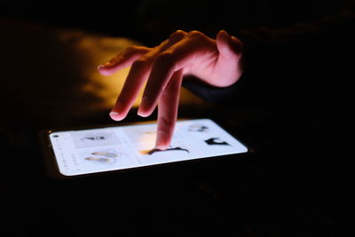 Close-up of hand holding paper