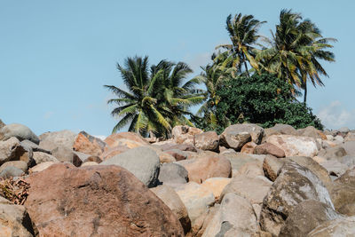 Scenic view of rocks against clear blue sky