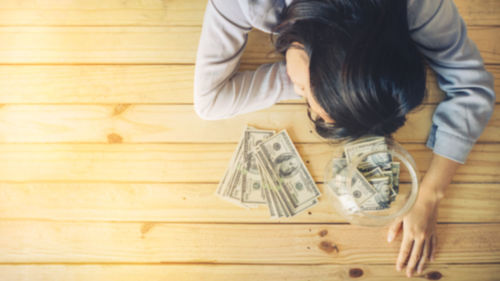 High angle view of woman wearing mask on table