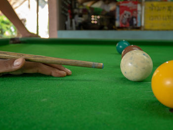 Person playing with ball on table