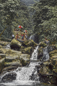 Scenic view of river flowing through rocks