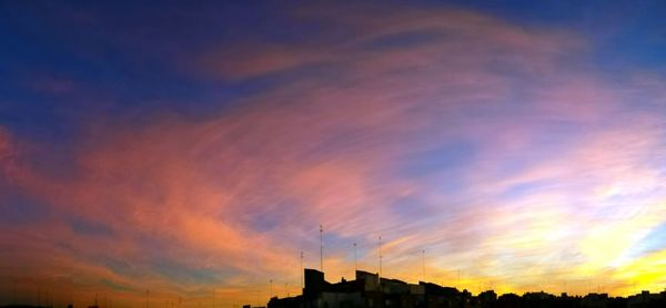 Low angle view of dramatic sky at sunset