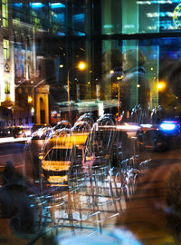 Illuminated city street at night