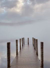 Pier over sea against sky