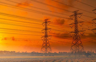 High voltage electric pylon and electrical wire with sunset sky. electricity poles. power and energy