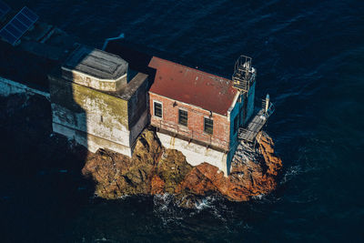 High angle view of built structure by sea