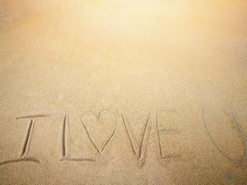 Text on sand at beach
