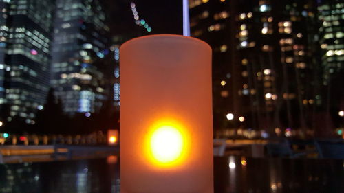 Close-up of illuminated lamp at night