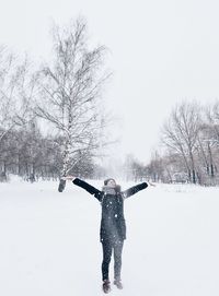 People standing on snow covered landscape