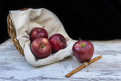 High angle view of apples on table against black background