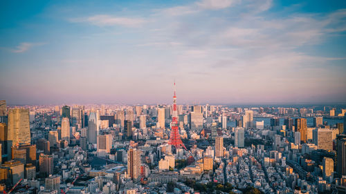 Aerial view of cityscape against sky during sunset