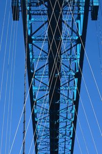 Low angle view of bridge against clear blue sky