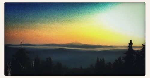 Scenic view of mountains at sunset