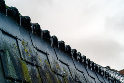 Low angle view of wall against sky