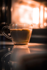 Close-up of coffee cup on table