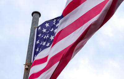 Low angle view of flag against sky