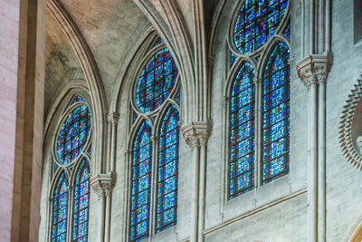 Low angle view of glass window in building