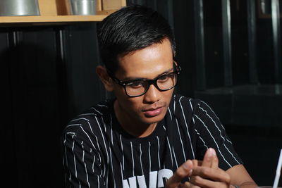 Portrait of young man looking away