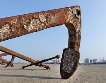 Close-up of rusty metal against sky