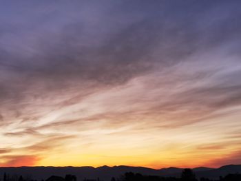 Low angle view of dramatic sky during sunset